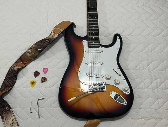 Guitarra eléctrica con funda correa y amplificador